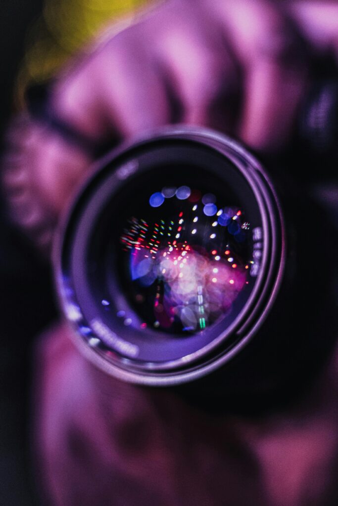 Vibrant reflections in a camera lens; an artistic photography close-up.